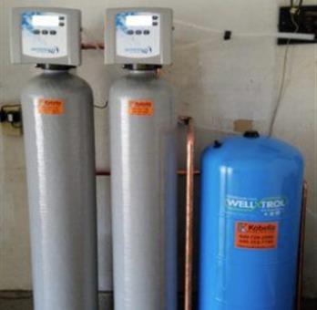 Well x troll water heaters lined up in basement